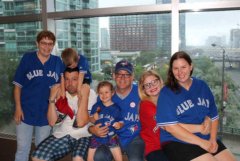 family dressed in toronto blue jays gear