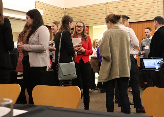 students standing and networking
