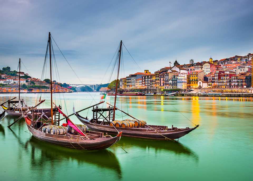 Boats in harbor at dusk.