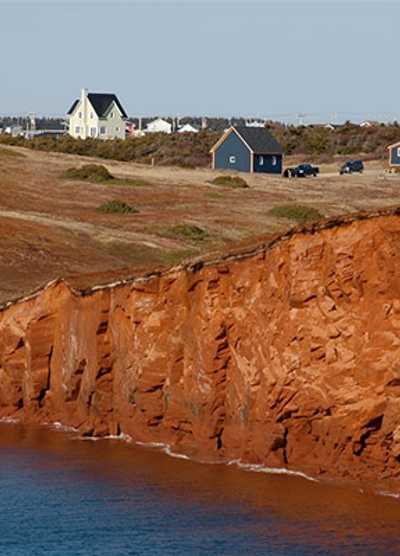 Houses among the red cliffs of Magdalen Islands